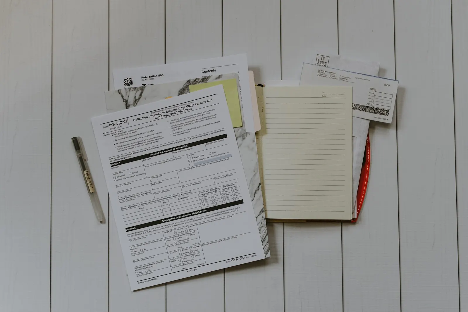 Insurance claim paperwork and decision letters on a desk