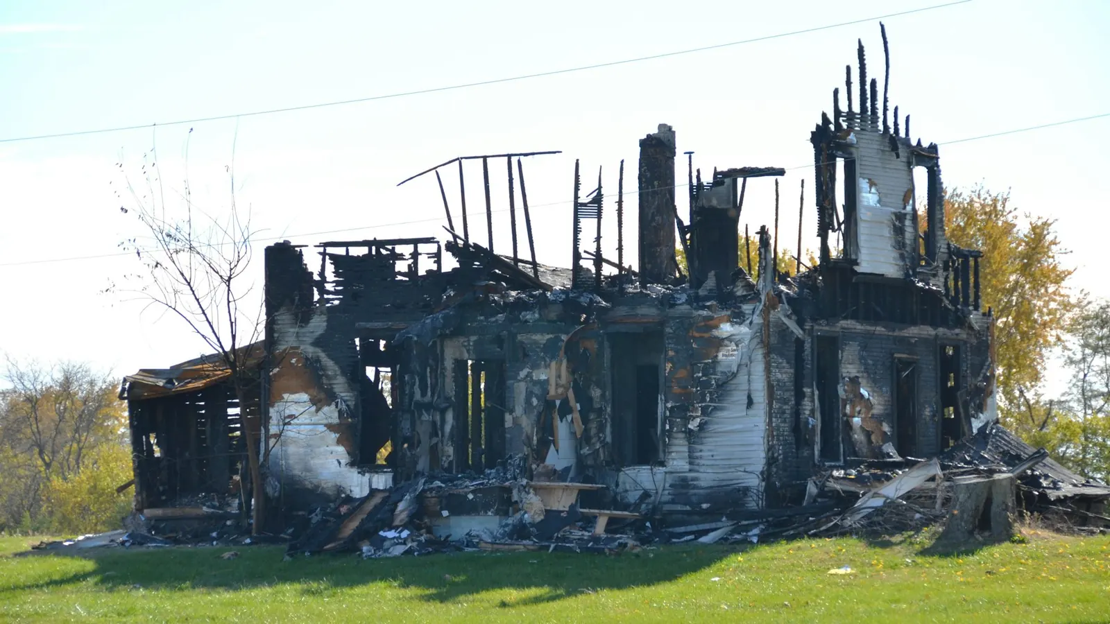 Fire-damaged house structure after a residential fire
